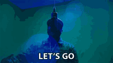 a man in a military uniform is singing into a microphone with the words let 's go written below him