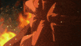 a close up of a person 's face with flames behind him