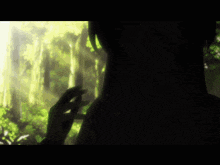 a person 's hand is reaching out towards a glowing object in the dark