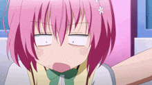 a girl with pink hair and a flower in her hair makes a funny face