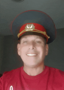 a man wearing a red hat and a red shirt with the number 0
