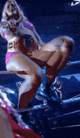 a woman in a bikini with a belt that says ecw