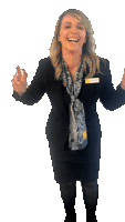 a woman wearing a black jacket and a scarf has a name tag that says ' sarah '