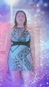 a woman in a blue dress is standing in front of a purple and blue background