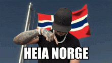a man wearing a ny hat stands in front of a norwegian flag that says heia norge