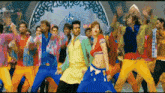 a group of people are dancing in front of a sign that says 4k video songs