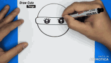 a person is drawing a ninja on a piece of paper with a zebra marker