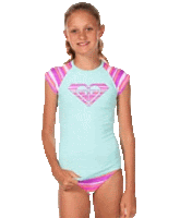 a young girl is wearing a roxy rash guard and bikini bottoms