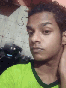 a close up of a person 's face with a helmet behind them