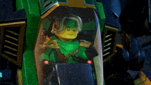 a lego figure is sitting in a green container