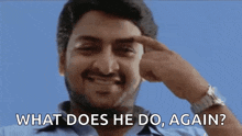 a man with a beard is pointing his finger at his forehead and asking what does he do again .