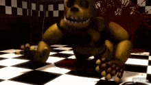 a yellow bear is sitting on a checkered floor in a dark room .