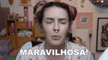 a woman with a nose ring says " maravilhosa " in front of her face