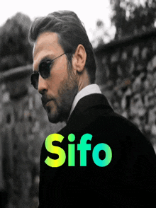 a man wearing sunglasses stands in front of a sign that says ' sifo ' on it