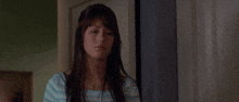 a woman says " you know i will " in front of a picture frame