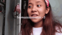 a girl is making a funny face with the words feymassssssss < 3 above her head