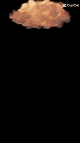 a candle is lit up in a dark room with smoke coming out of it .