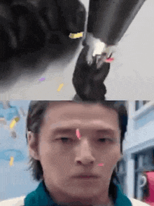 a close up of a person 's face and a close up of a cat 's paw on a person 's head