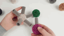 a person is holding a star made out of magnets