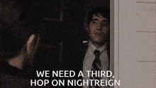 a man in a suit and tie is talking to another man in a doorway and says we need a third hop on nightreign