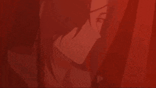 a close up of a person 's face with a red background