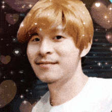 a close up of a man 's face surrounded by hearts and stars
