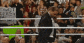 a wrestling ring with a sign that says " thwest ders " on it