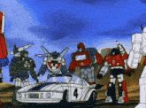 a group of transformers are standing around a car with the number 4 on the side