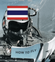 a man in a helmet is sitting in an airplane with a sign that says how to fly