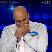 playing harmonica ayman family feud canada playing instrument humming