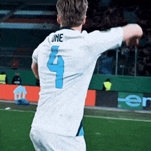 a man wearing a jersey with the number 4 on it