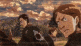 a group of men are standing next to each other in a field and looking at each other .