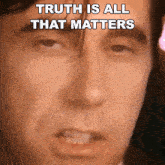 a close up of a man 's face with the words " truth is all that matters " above it
