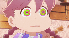 a close up of a girl 's face with a hypnotic eye