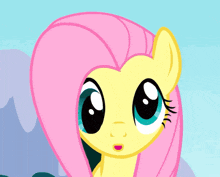 a close up of a cartoon pony with big blue eyes