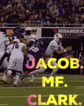 a football player named jacob clark is being tackled by another player