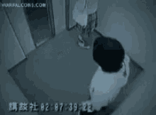 a person is standing in an elevator with a time of 07:29