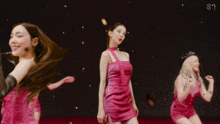 a woman in a pink dress with the letter s on it