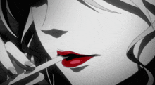 a woman with red lips is holding a cigarette in her mouth
