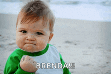 a baby with a fist in the air and brenda written on the bottom