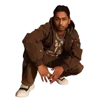 a man squatting down with ashwin gane written on the bottom