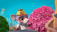 a cartoon mouse wearing a helmet and goggles stands in front of a pink tree