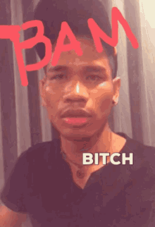 a man in a black shirt with the words bam bitch above him