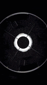 a futuristic clock with a circle in the middle and numbers on the face