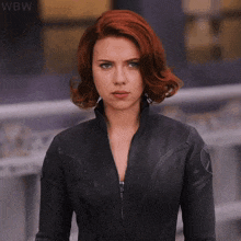 a woman with red hair is wearing a black leather jacket and says i 've seen worse