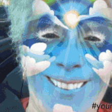 a person with blue paint on their face and the hashtag #your on the bottom