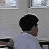 a close up of a man making a funny face while wearing a headset .