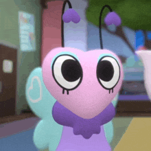 a cartoon character with a heart shaped face and purple wings