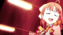 a girl in a red dress is singing into a microphone .