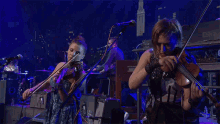 playing violin sarah neufeld arcade fire the suburbs song violinist